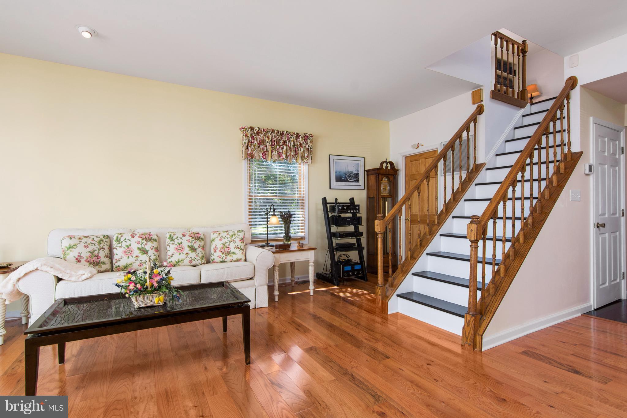 8087 Ventnor Road Pasadena, MD 21122 - Photo 17 of 30 Great room with stairs to upper level