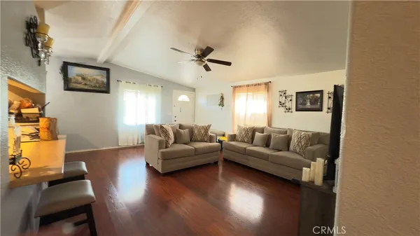 a living room with couches and a coffee table