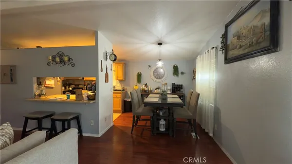 a view of a livingroom with furniture and a flat screen tv