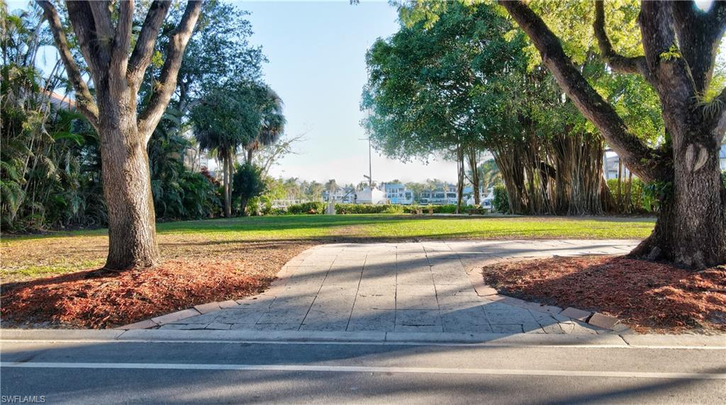 442 18th Avenue South Naples, FL 34102 - Photo 2 of 6 a view of a swimming pool and a yard