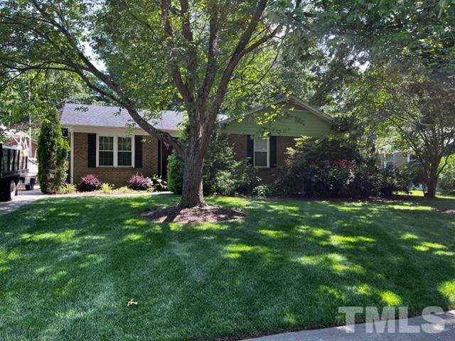 7405 Mine Valley Road Raleigh, NC 27615 - Photo 1 of 24 a view of a house with a yard and tree s