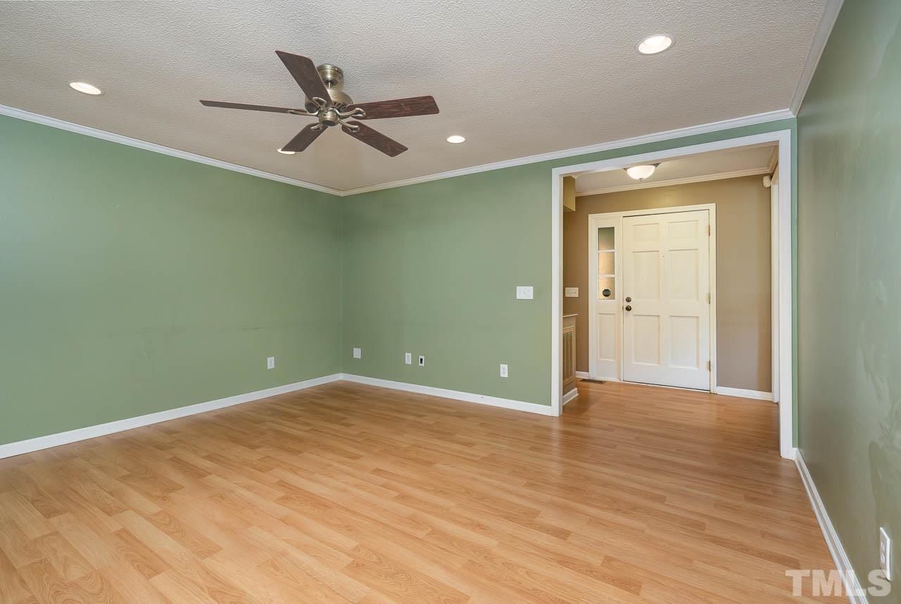 7405 Mine Valley Road Raleigh, NC 27615 - Photo 14 of 24 wooden floor in an empty room with a window