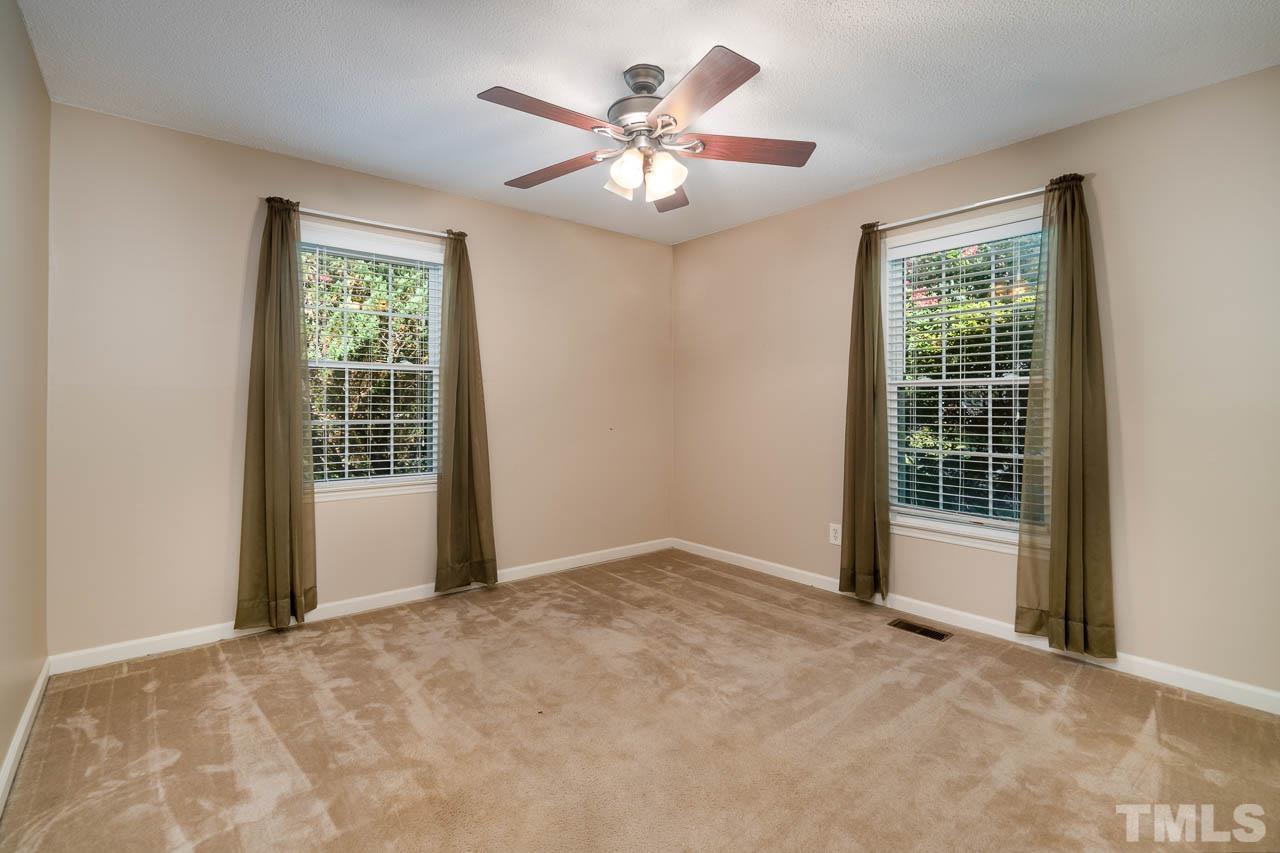 7405 Mine Valley Road Raleigh, NC 27615 - Photo 18 of 24 a view of an empty room with a window