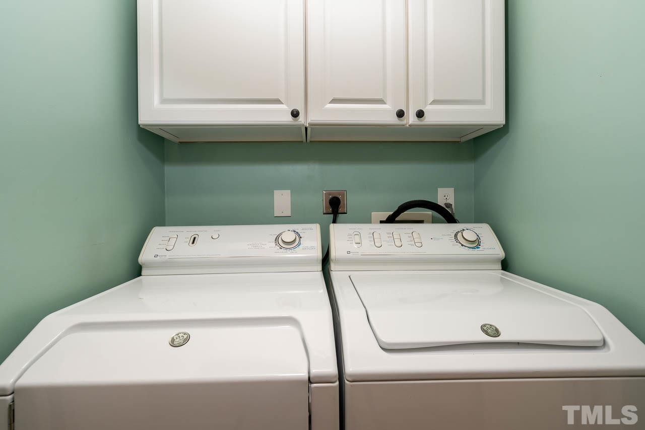 7405 Mine Valley Road Raleigh, NC 27615 - Photo 20 of 24 a utility room with dryer and washer