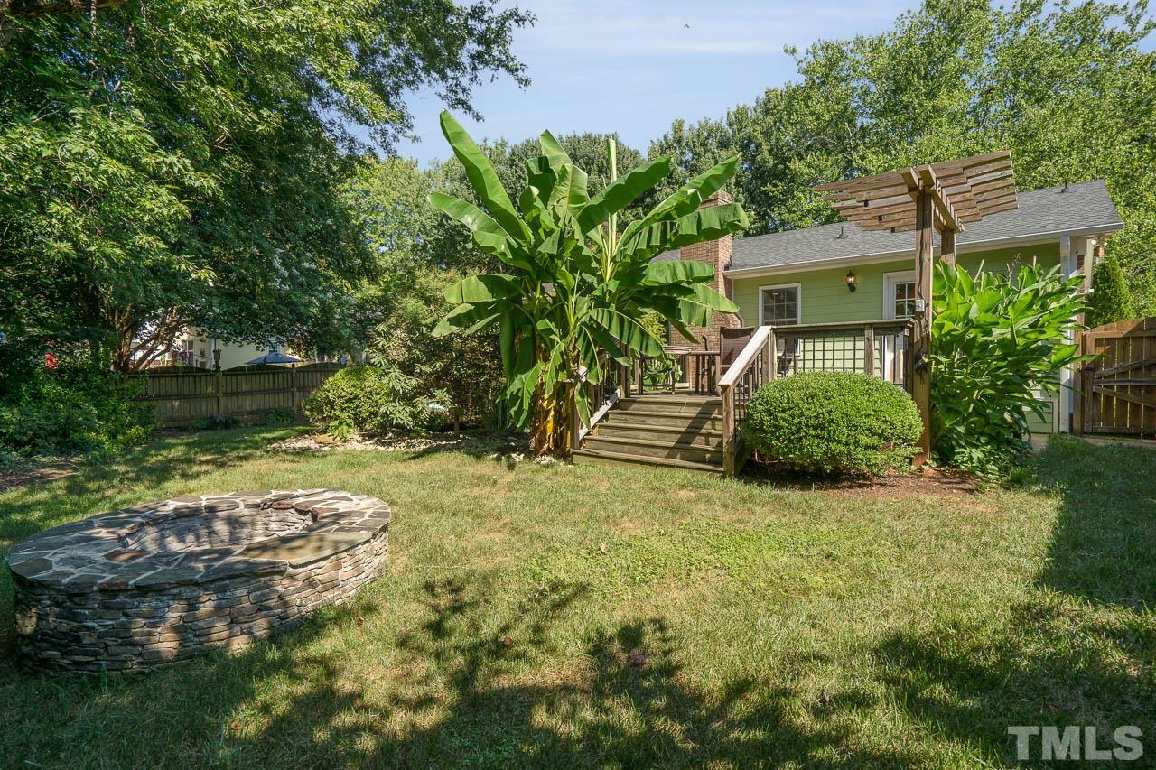 7405 Mine Valley Road Raleigh, NC 27615 - Photo 6 of 24 a backyard of a house with a garden and plants