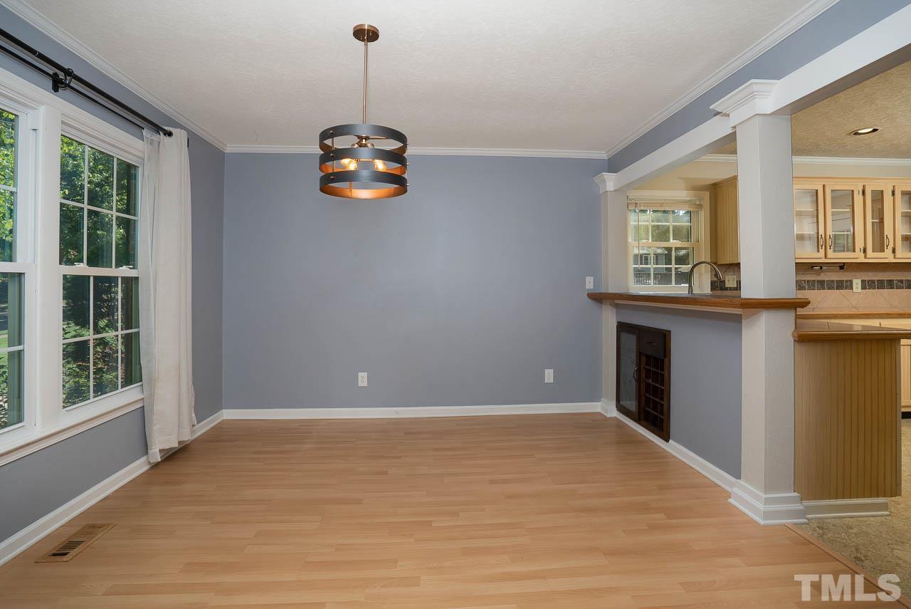7405 Mine Valley Road Raleigh, NC 27615 - Photo 8 of 24 a view of an empty room with a window