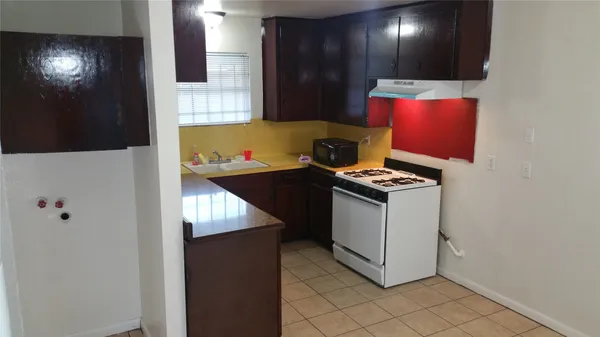 a kitchen with stainless steel appliances granite countertop a stove and a refrigerator