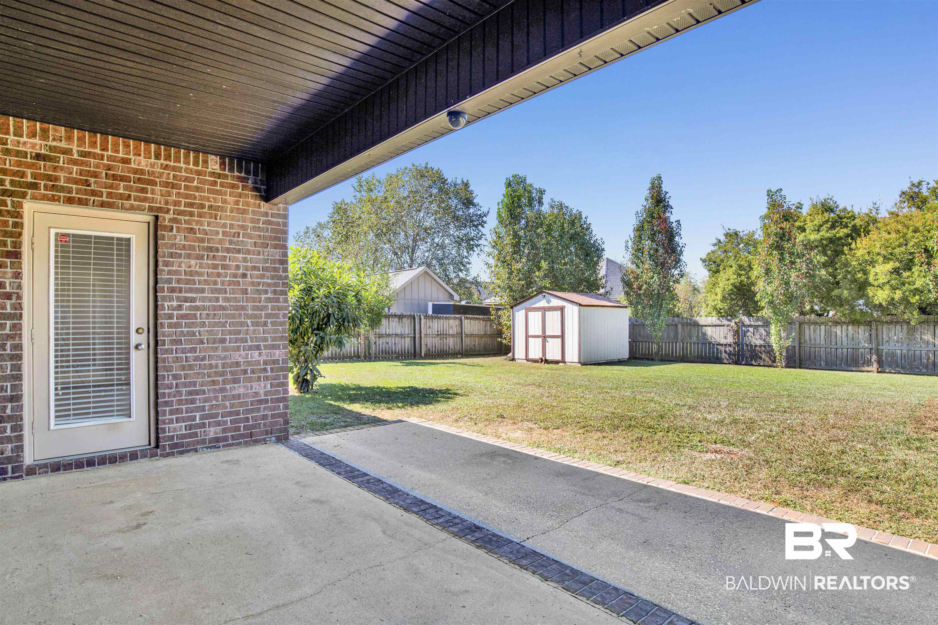 24159 Tullamore Drive Daphne, AL 36526 - Photo 27 of 31 View of patio with a storage shed