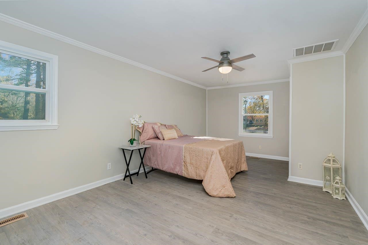 5917 Meadowlark Lane Raleigh, NC 27610 - Photo 11 of 24 a bedroom with a bed and a window