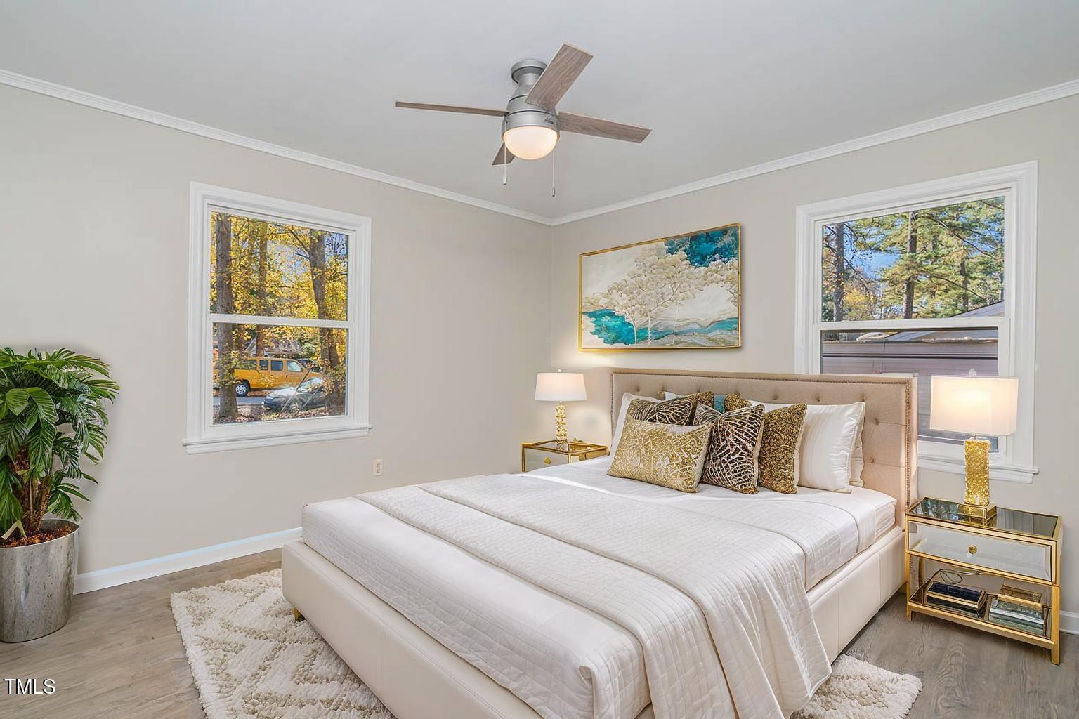 5917 Meadowlark Lane Raleigh, NC 27610 - Photo 15 of 24 a bedroom with a large bed and a window