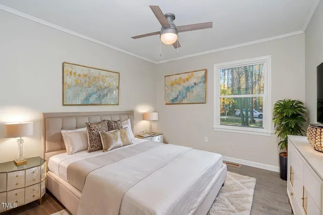 an empty room with a window and a ceiling fan