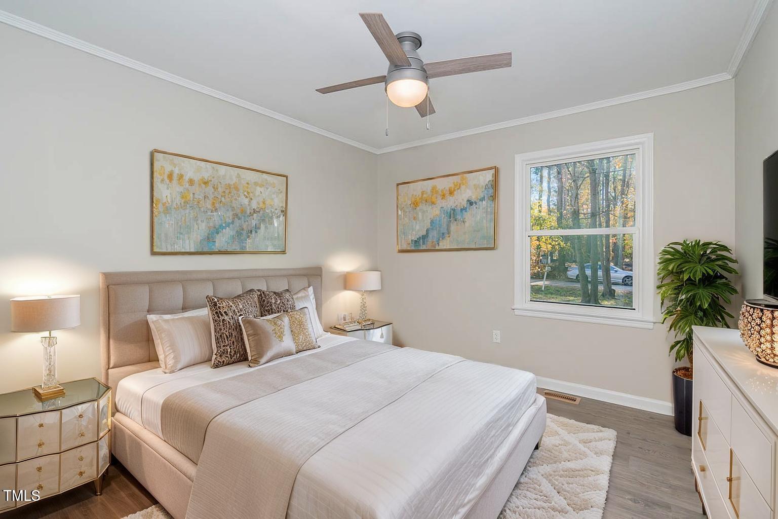 5917 Meadowlark Lane Raleigh, NC 27610 - Photo 17 of 24 a bedroom with a large bed and a window