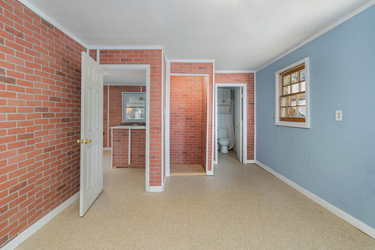 5917 Meadowlark Lane Raleigh, NC 27610 - Photo 19 of 24 an empty room with windows