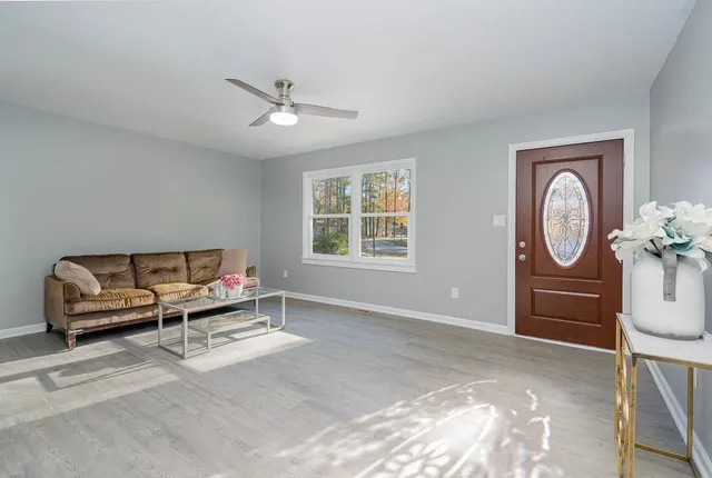 a bed room with a bed and a chandelier