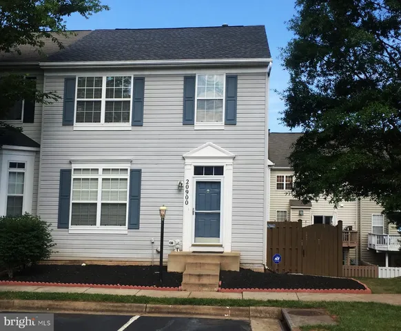 a front view of a house with a garage