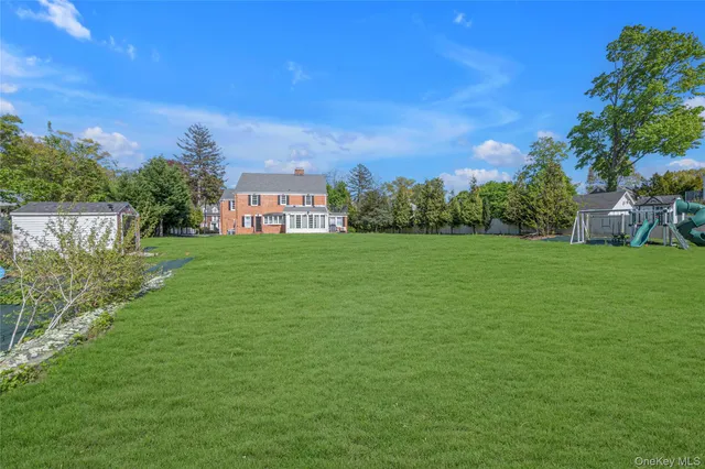 a view of a big yard next to a house