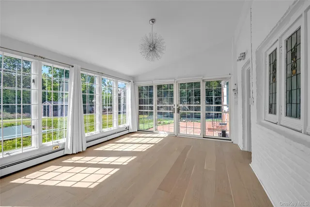 a view of a room with a large window