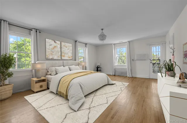 a spacious bedroom with a balcony a bed and a couch