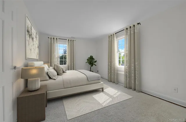 a bedroom with bed and window