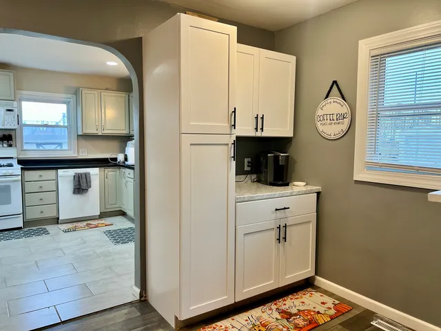a view of cabinets with wooden floor