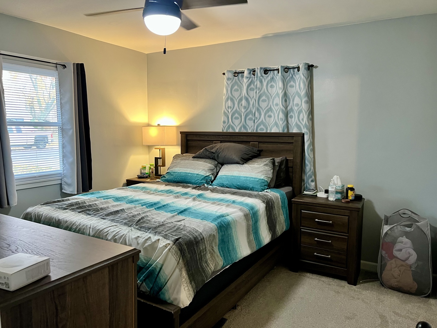 113 Walnut Street Gibson City, IL 60936 - Photo 17 of 33 a bedroom with a bed and a chandelier