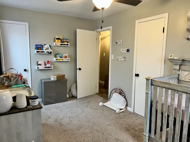 a bedroom with furniture and a wooden floor