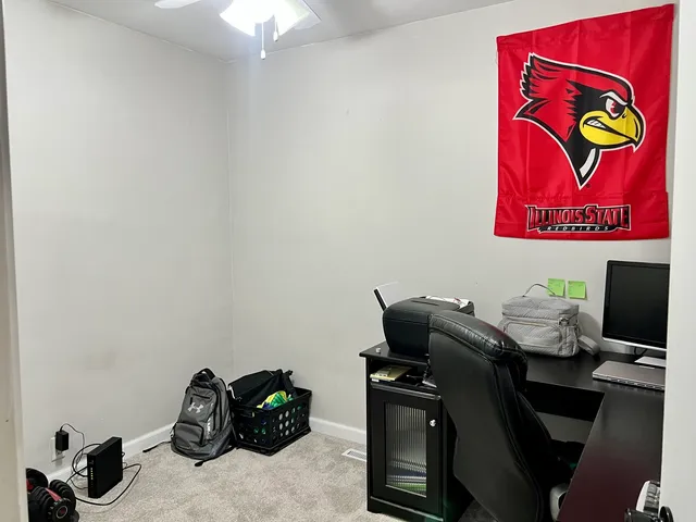 a view of a workspace with furniture