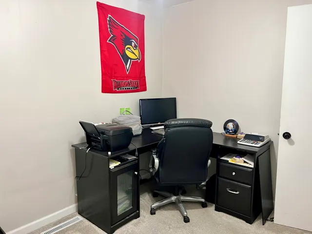 a view of workspace with cabinets