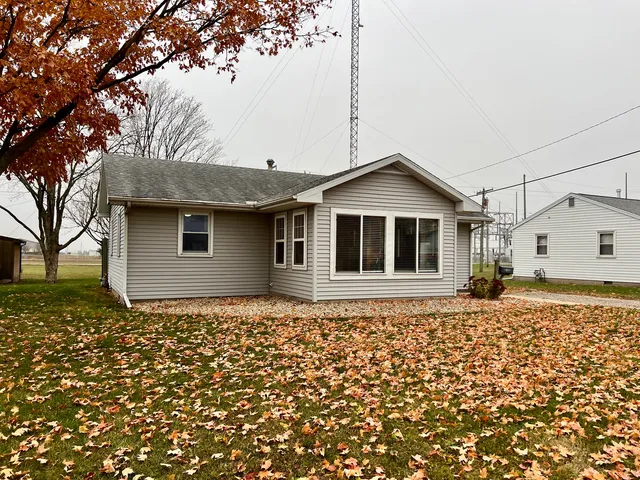 a house with trees in the background