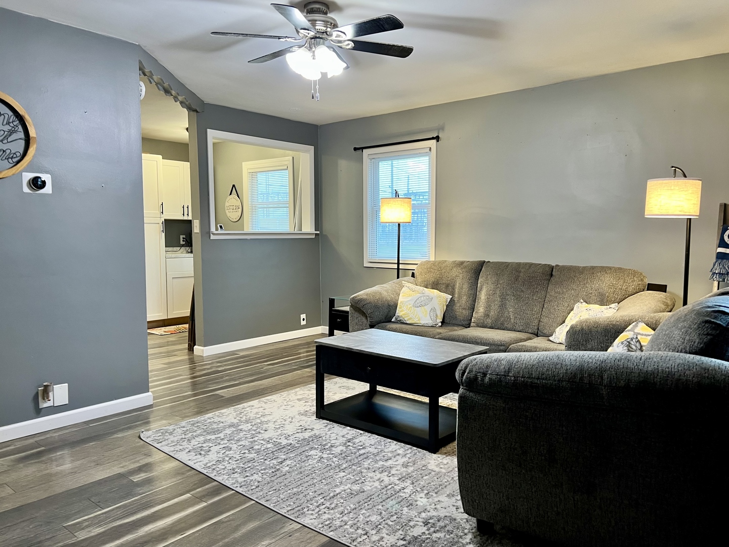 113 Walnut Street Gibson City, IL 60936 - Photo 5 of 33 a living room with a couch and a chandelier