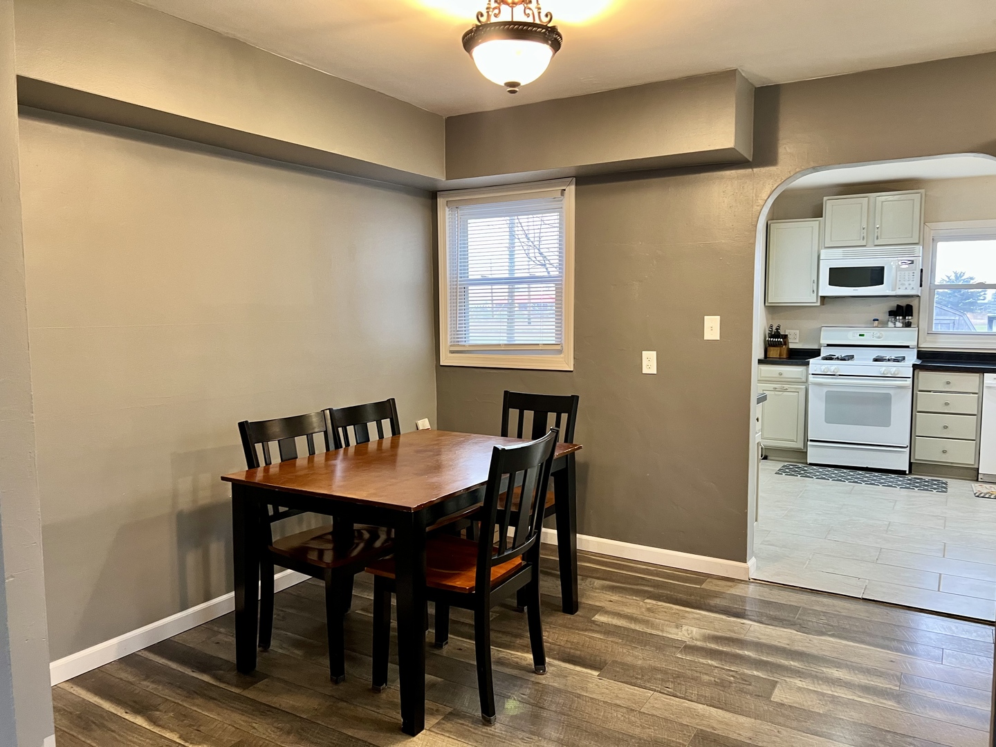 113 Walnut Street Gibson City, IL 60936 - Photo 9 of 33 a view of a dining room with furniture and wooden floor