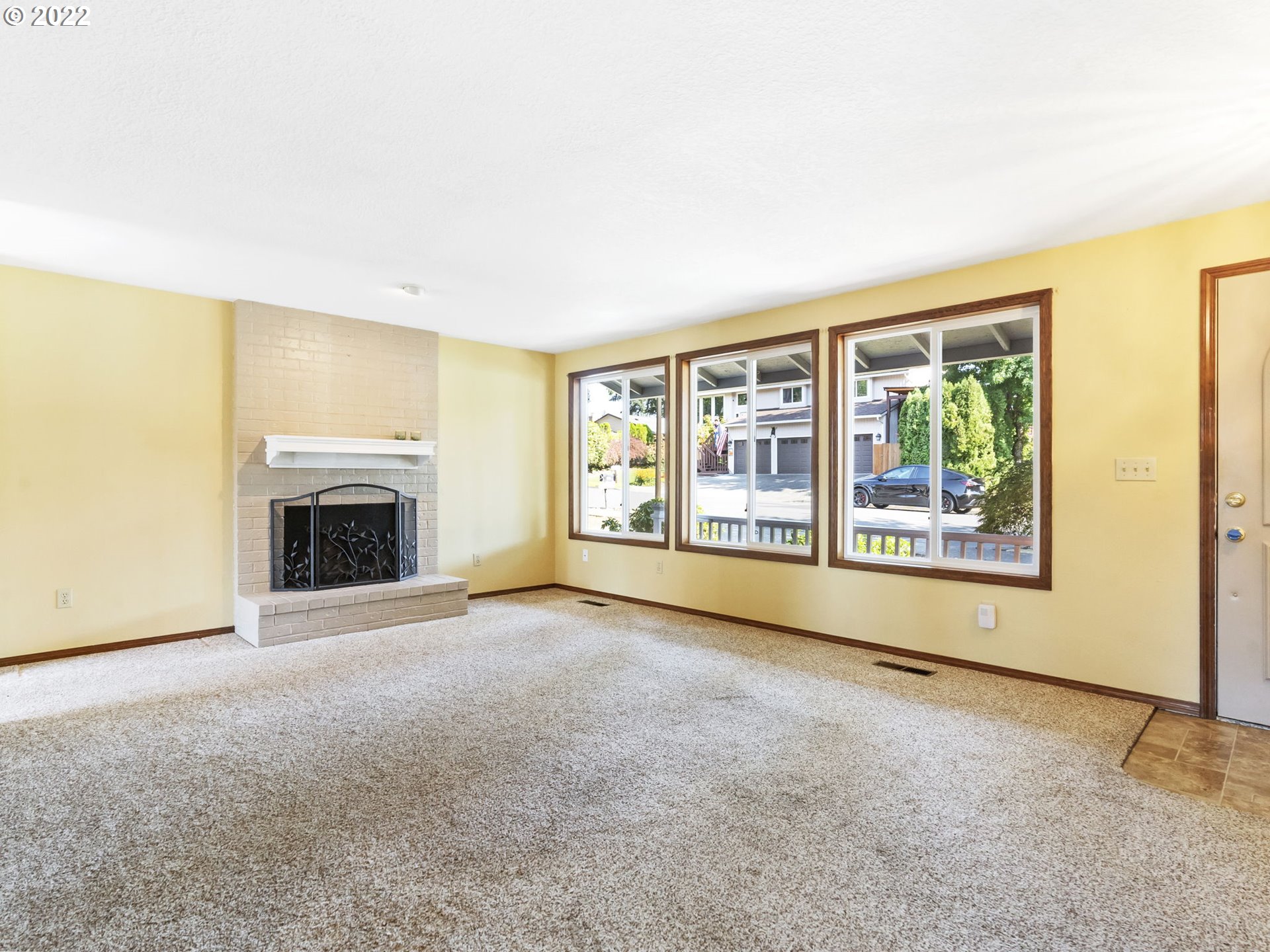 18045 Davis Street Sandy, OR 97055 - Photo 2 of 27 a view of an empty room with a fireplace and a window