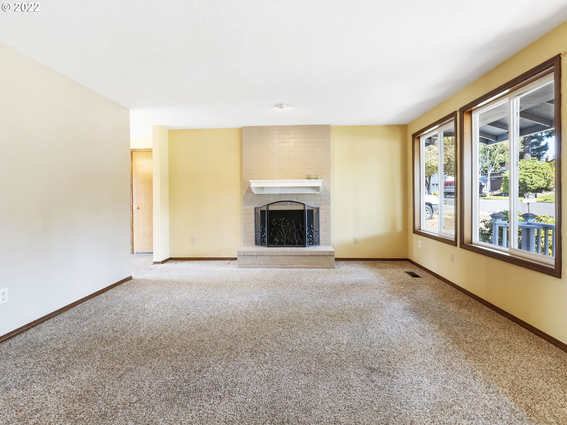18045 Davis Street Sandy, OR 97055 - Photo 3 of 27 an empty room with furniture and a fireplace