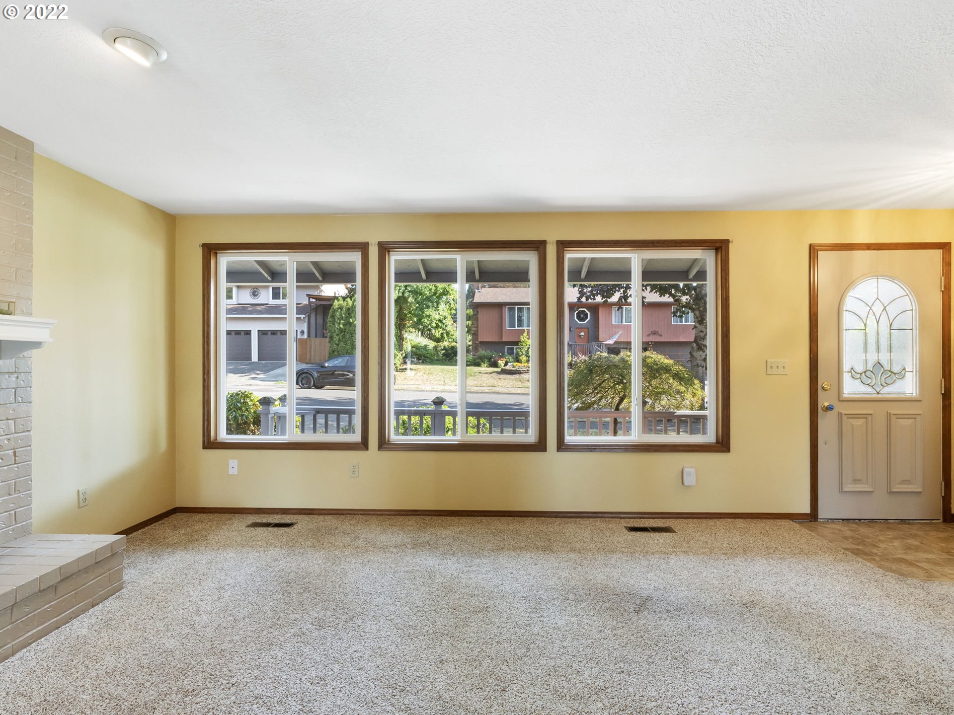 18045 Davis Street Sandy, OR 97055 - Photo 4 of 27 an empty room with windows and entrance