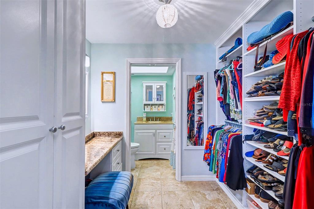 17400 Gulf Boulevard, Unit H2 Redington Shores, FL 33708 - Photo 22 of 36 a view of walk in closet with clothes and shoes