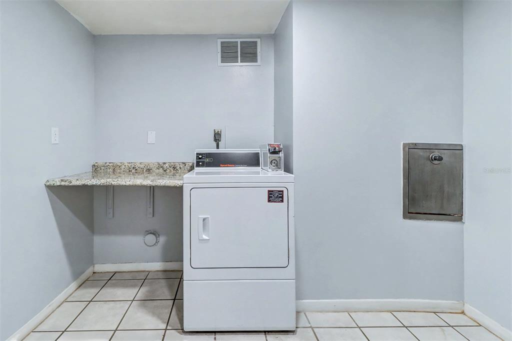 17400 Gulf Boulevard, Unit H2 Redington Shores, FL 33708 - Photo 24 of 36 a utility room with washer and dryer