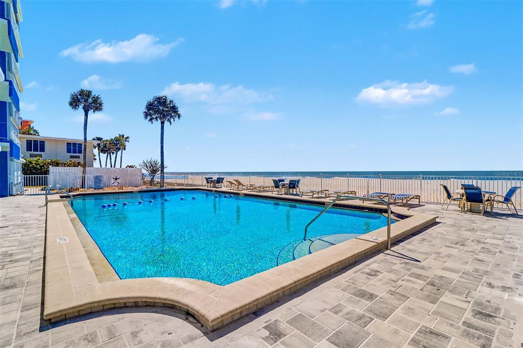 17400 Gulf Boulevard, Unit H2 Redington Shores, FL 33708 - Photo 26 of 36 a view of a swimming pool and lounge chair