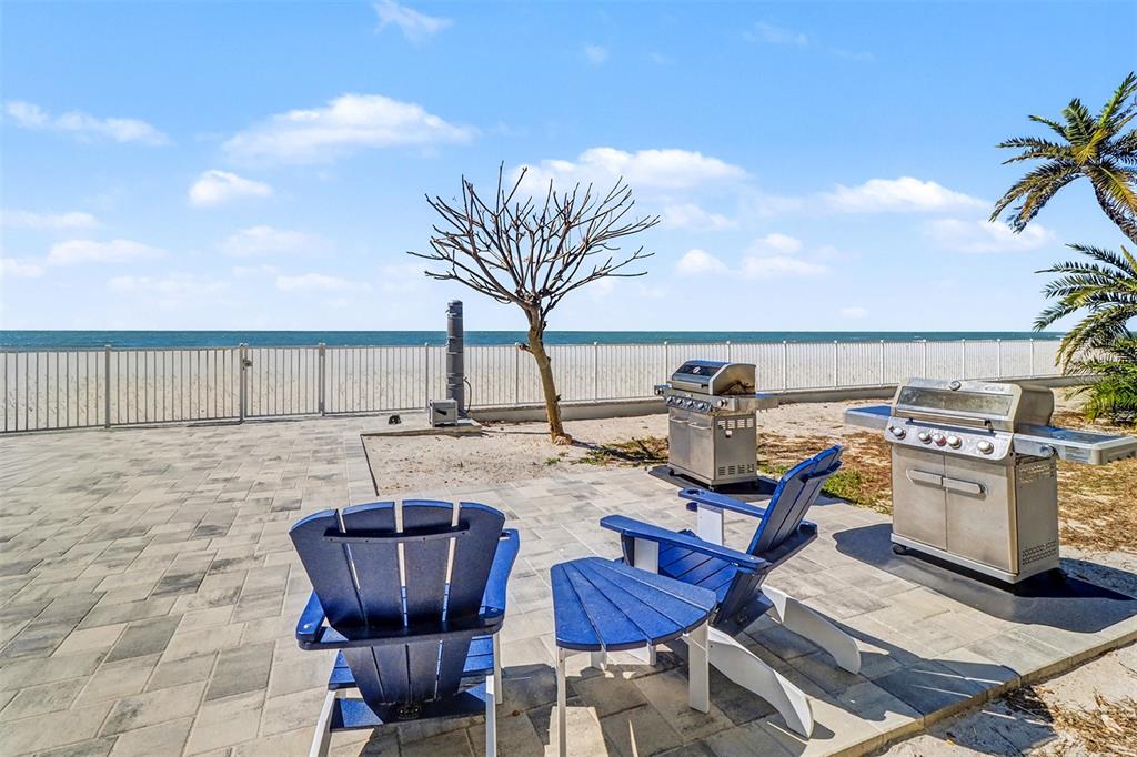 17400 Gulf Boulevard, Unit H2 Redington Shores, FL 33708 - Photo 29 of 36 a view of a chairs and table in the patio