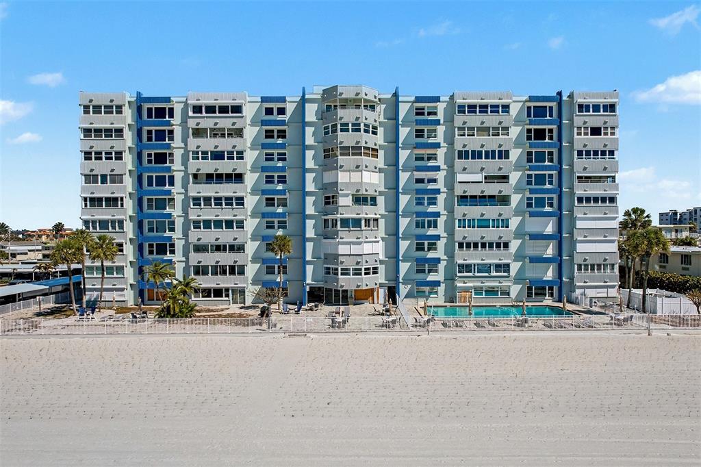 17400 Gulf Boulevard, Unit H2 Redington Shores, FL 33708 - Photo 34 of 36 a tall building sitting next to a road