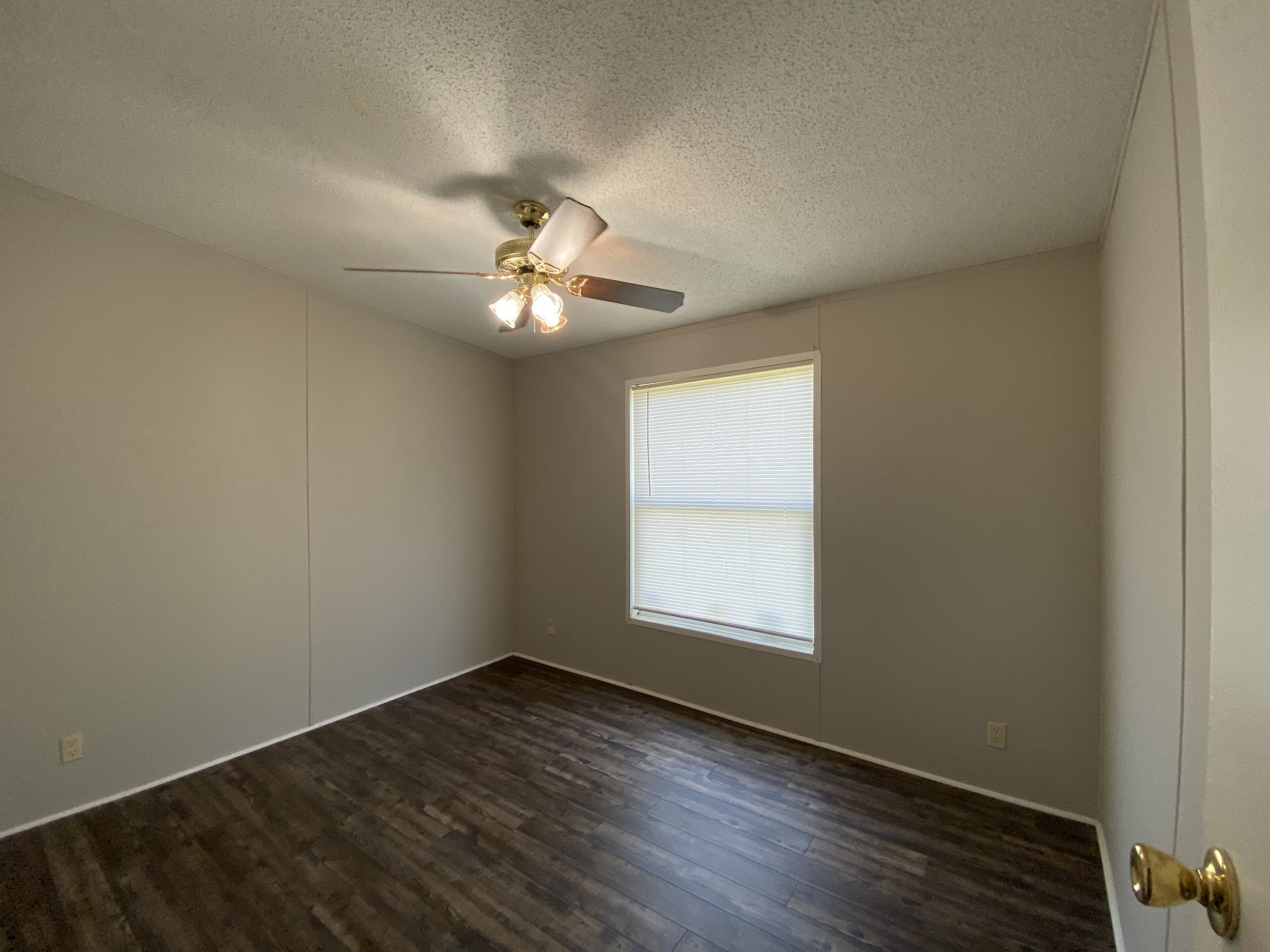 8505 Highway 41 Adams, TN 37010 - Photo 9 of 14 an empty room with wooden floor and window