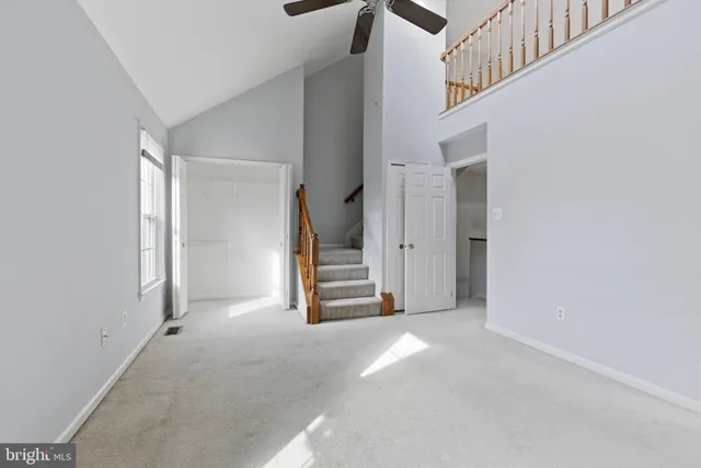 a view of a hallway view with staircase