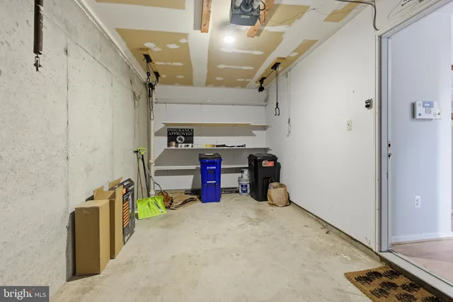 a view of a backyard with wooden fence
