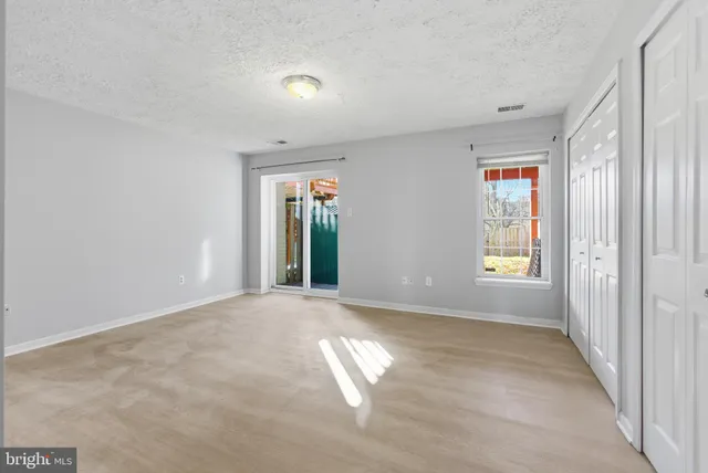 an empty room with windows