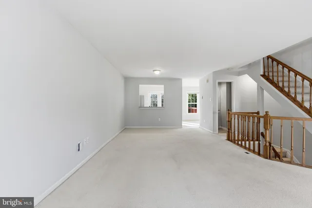 a view of a hallway with staircase
