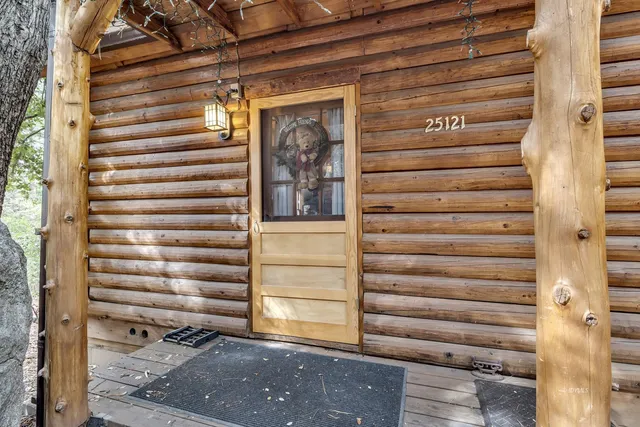 a kitchen with a stove a sink and a wooden cabinets