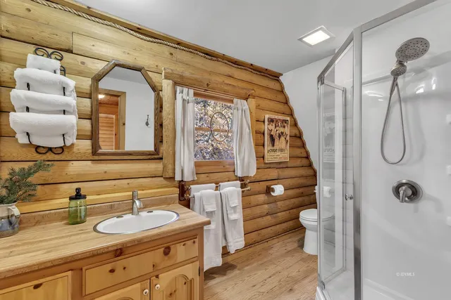 a bathroom with a sink toilet and mirror