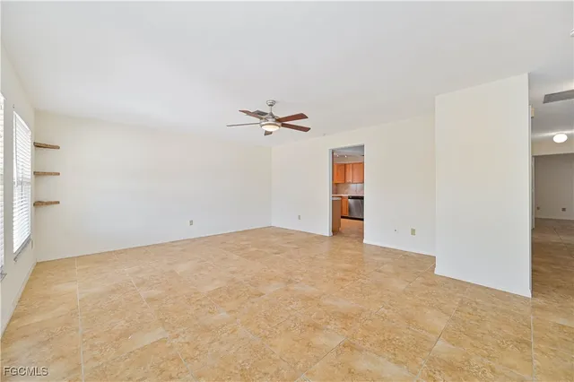 an empty room with closet and cabinet