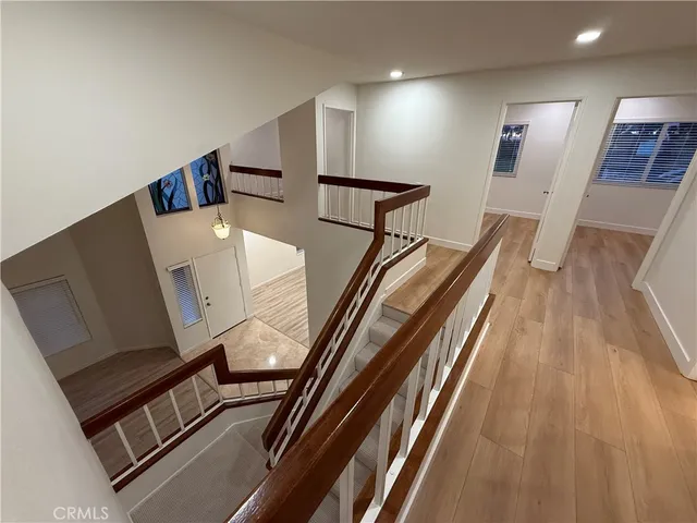 a view of entryway with stairs and wooden floor