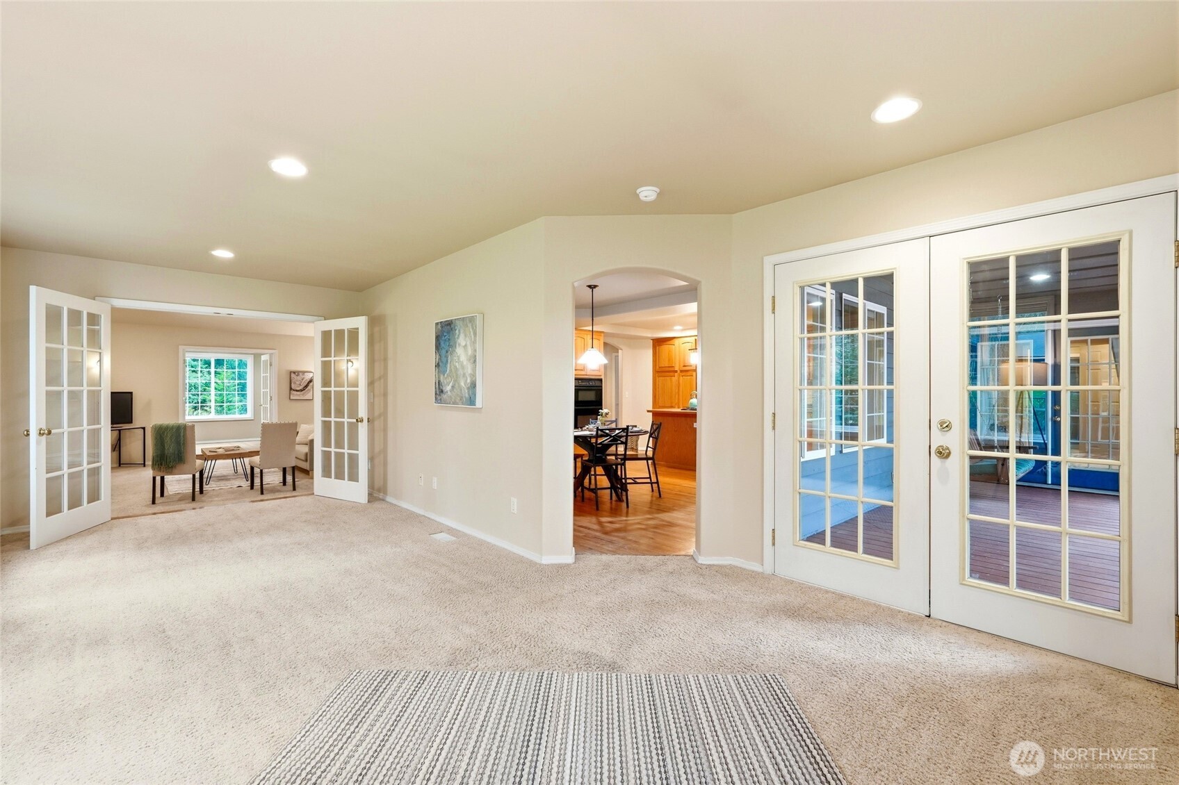 1026 McRae Road Northwest Arlington, WA 98223 - Photo 12 of 40 a view of a livingroom with wooden furniture and windows