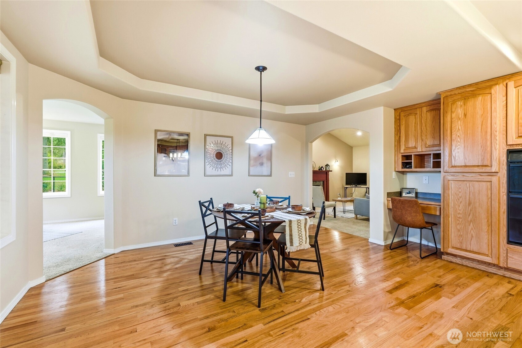 1026 McRae Road Northwest Arlington, WA 98223 - Photo 15 of 40 a view of a dining room with furniture window and wooden floor